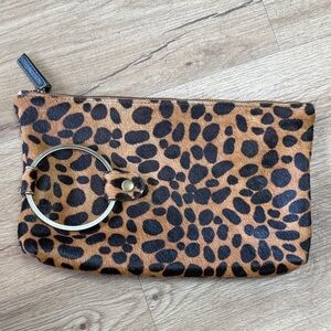Kim White Leopard Print. Leather is Cow Hair printed Ring Clutch NWOT